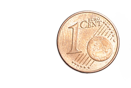 Extreme macro close-up of a copper 1 one euro cent coin as the smallest monetary unit of the European common currency on a white background as a concept for cash coins and savings.