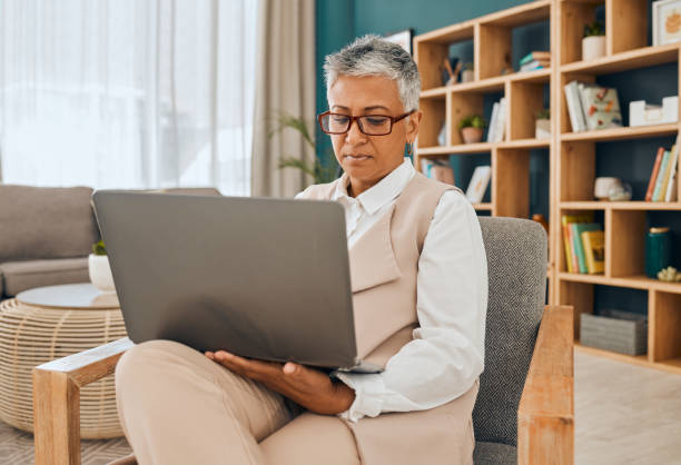 istock Mature psychologist, computer work and serious psychology doctor doing research in office. Therapist, reading and digital data planning of a mental health worker looking at online counseling notes 1484260203
