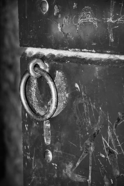 istock Close-up image of an old door with a circle iron door handle 1484260732