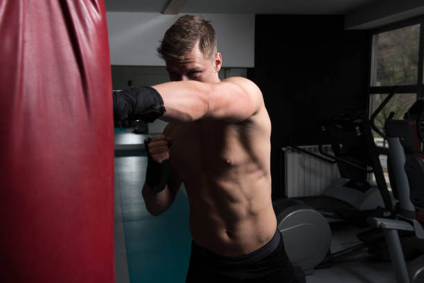 Boxer With Punch Bag In Action stock photo