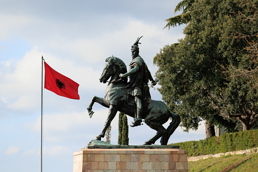 Albanian flag and Statue Of Skanderbeg in Kruja