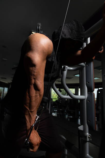 Bodybuilder Doing Heavy Weight Exercise For Triceps stock photo