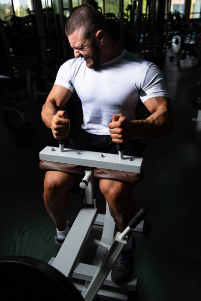 istock Athlete Exercising Calves In The Gym 1484263519