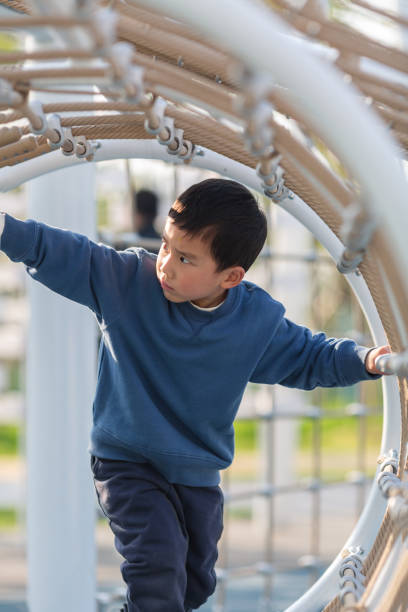 istock Asian boy playing outdoors 1484264628