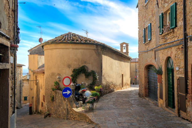 Narrow Alley with Old Buildings in Italian City of Volterra