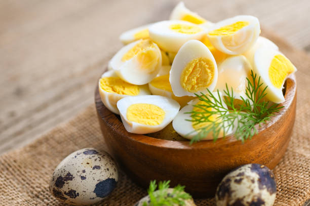 istock boiled eggs food, quail eggs on wooden bowl, breakfast eggs with fresh quail eggs and vegetable lettuce on table background 1484270452