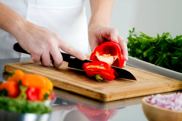 istock Food Preparation - Cutting a Red Bell Pepper 148427113