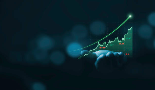 istock Businessman holding glowing virtual technical graph and chart for analysis stock market , technology investment and value investment concept. 1484272585