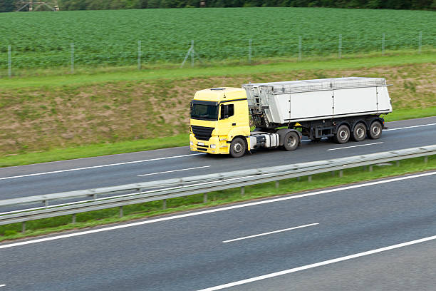 istock Yellow truck on highway 148427504