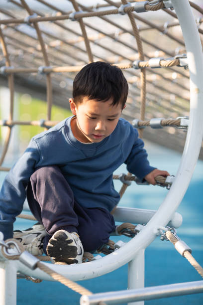 istock Asian boy playing outdoors 1484276137