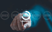 Businessman touching virtual 2024 number and download  for merry Christmas and happy new year by technology concept.