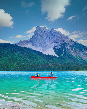 couple in a canoe at the lake, Emerald Lake, Yoho National Park in Canada. men and women in a canoe