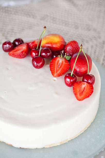 istock White Cream Icing Cake with Fruits 148427859