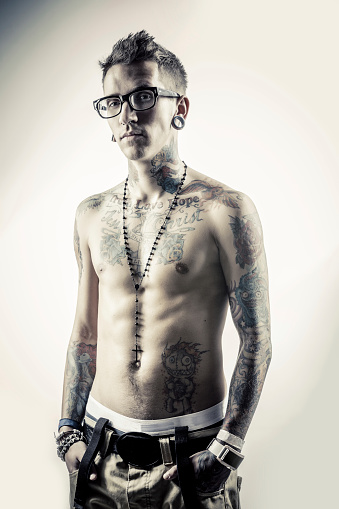 Young Male With Tattoos Stock Photo - Download Image Now - Belly Ring,  White Background, Bracelet - iStock