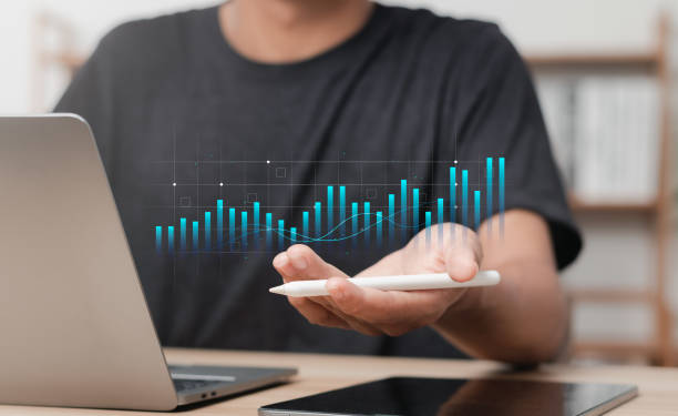istock Businessman analyzing growth graphs of economic data and making investment plans. Digital marketing, finance and investment concept. 1484287434