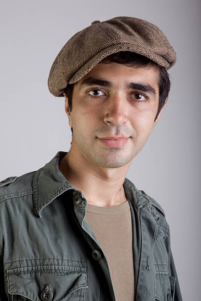 Young adult man with hat