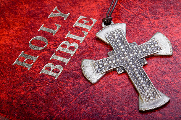 istock Cross on Holy Bible 148428987