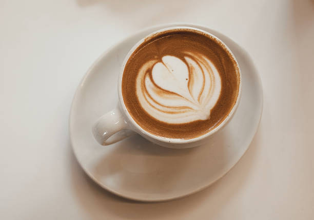 istock A cup of cappuccino on a white table 1484290050
