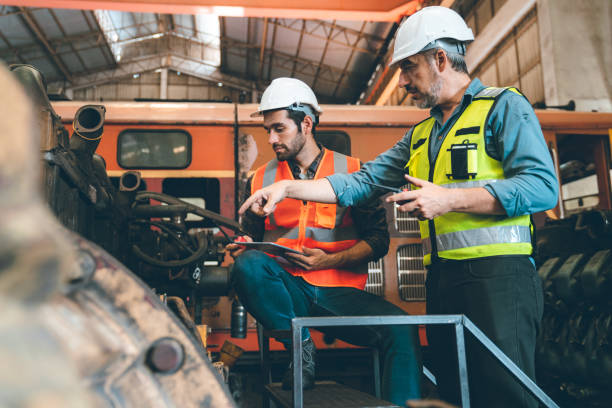 istock professional technician engineer with safety working in industrial manufacturing factory, checking equipment of machinery production technology construction operating, success commitment determination 1484293337