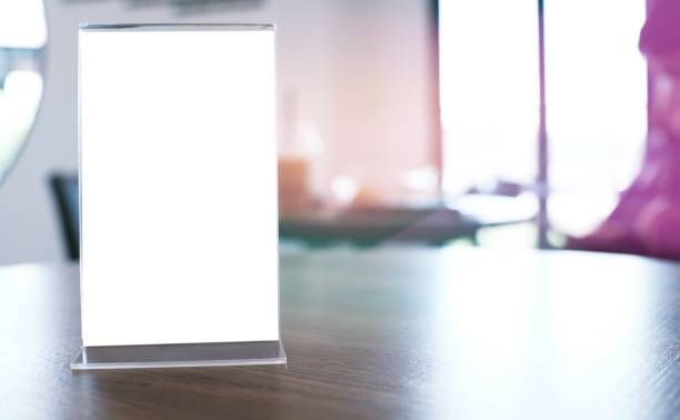 istock Menu frame standing on wood table in Bar restaurant cafe. space for text marketing promotion. 1484296192