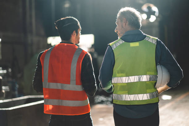 istock professional industry occupation man and men at work concept, factory, manufacturing engineer training a work to manager foreman for business safety technology, construction machine learning workshop 1484297255