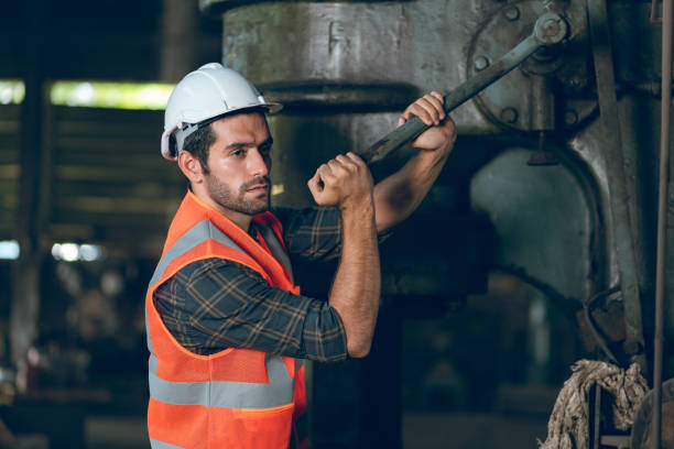 istock men at work concept, confident engineer person man occupation or professional manufacturing technician foreman portrait with industry safety helmet, inspector job manager to work in factory warehouse 1484297636