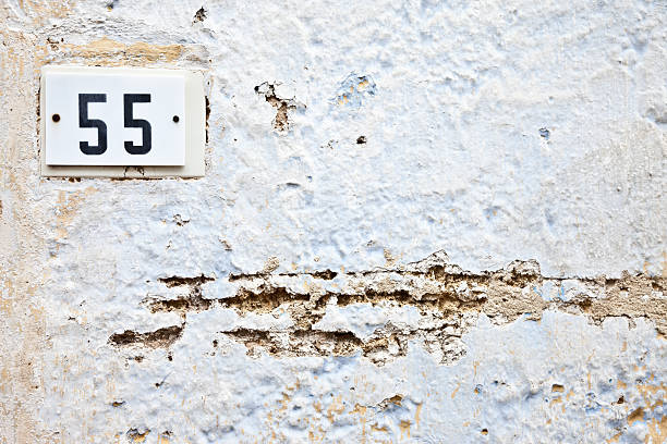 istock 55, Street Number On The Wall 148430016