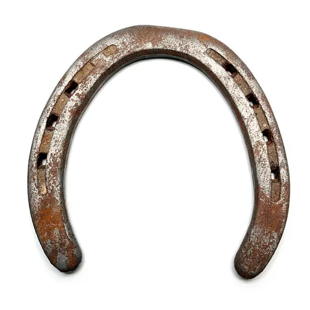 Closeup of a old, rusty horseshoe.