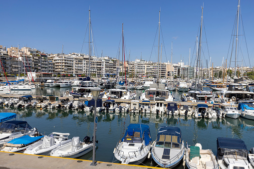 Athens, Piraeus, Greece - October 18, 2022: View of the port in the Bay of Zea (Pasalimani) with moored yachts on a beautiful sunny day