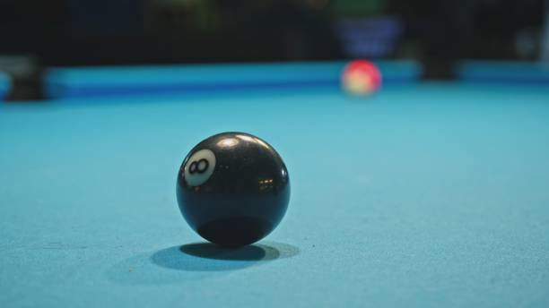 istock Pool Black Eight Ball on Blue Fabric Table 1484310671
