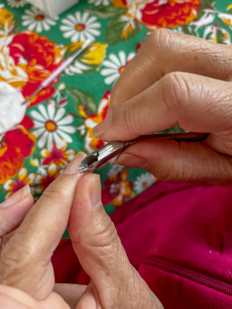 istock Senior Hispanic woman self manicure at home 1484312549