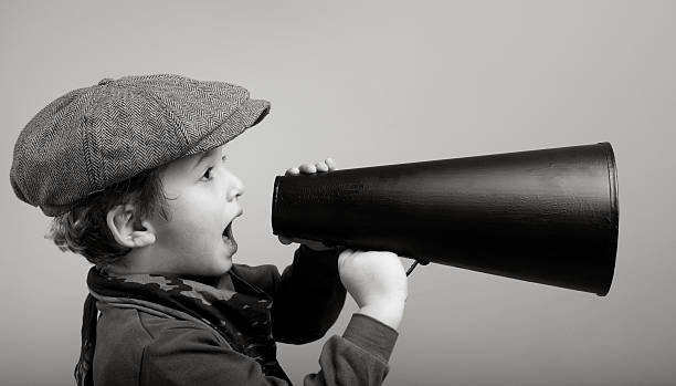 istock Little boy wearing newsboy cap Shouting With Megaphone 148431817