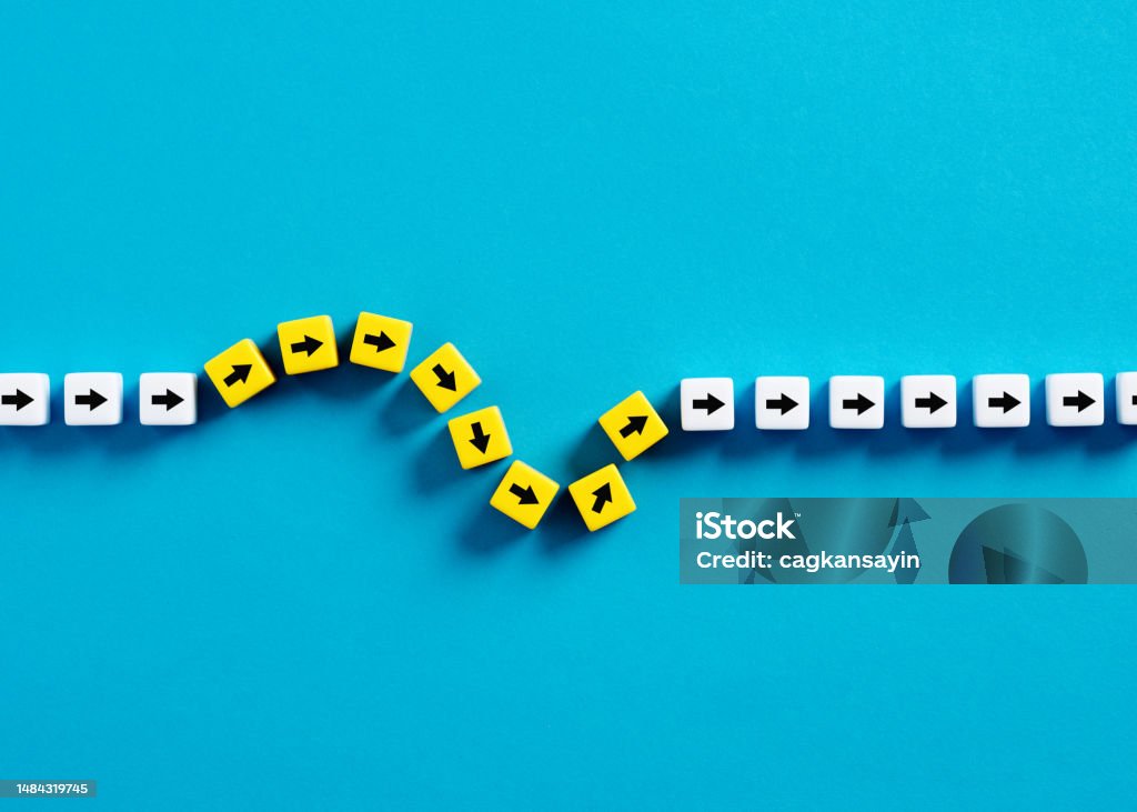 Flexibility and adaptation concept. Arrows on cubes following a flexible path. Flexibility Stock Photo