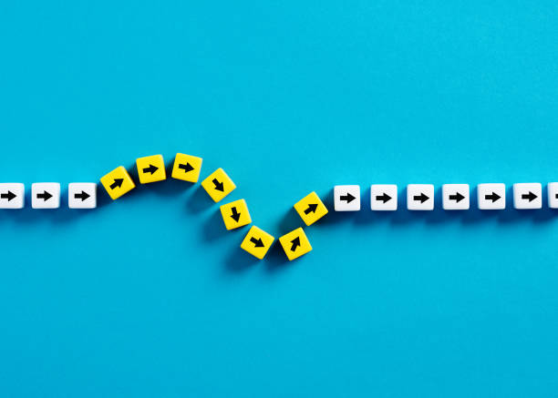 flexibility and adaptation concept. arrows on cubes following a flexible path. - change imagens e fotografias de stock