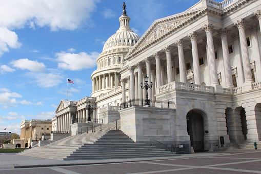 The Capitol Building in Washington, D.C., USA lit up in the early evening.