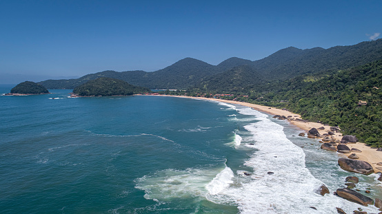 Aerial view to wonderful Green Coast shoreline and mountains covered with Atlantic Forest, Picinguaba, Brazil