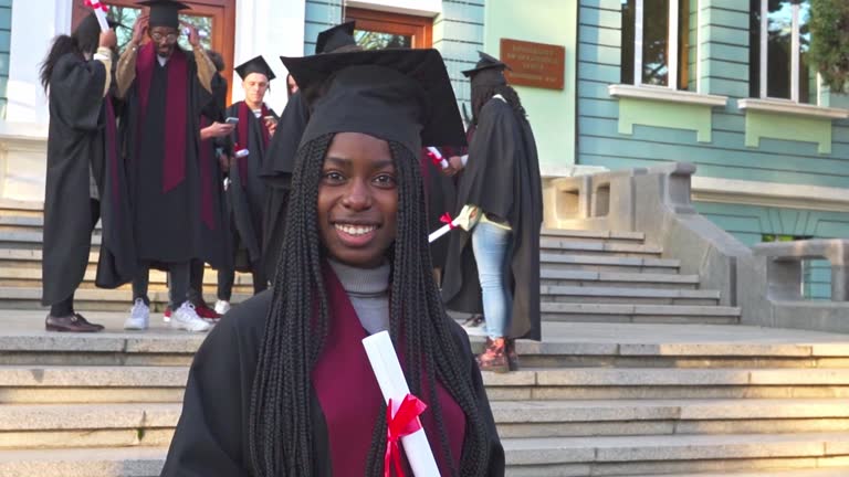 Graduate posing for a photo on graduation day