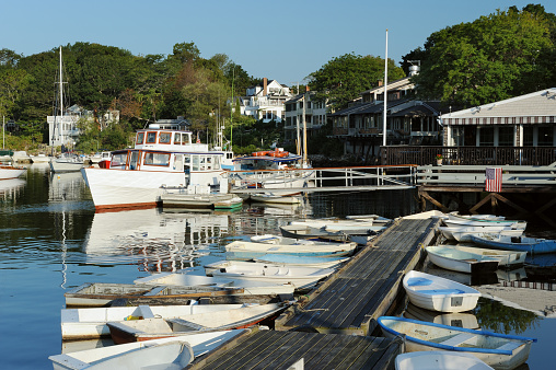 Boats and skifs moored in Perkins Cove harbor, Maine, USA