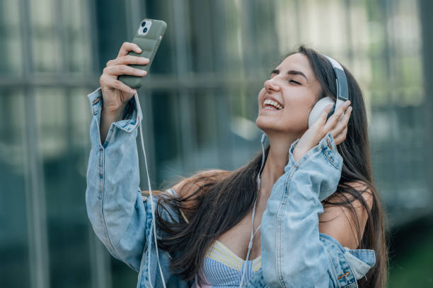 istock influencer with mobile phone and headphones 1484332934