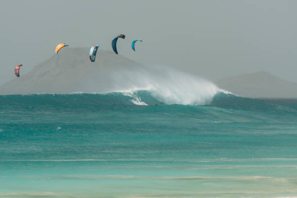 istock Kite surfer in the water with very high waves and strong wind 1484337509