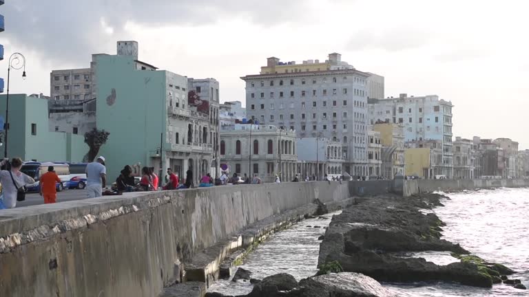 Havana Downtown and Malecon Avenue. Unique Old Taxi Cars and People In Background. Cuba