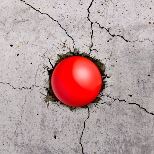palla sfera rossa che vola attraverso il muro con crepe - baseballs baseball breaking broken foto e immagini stock