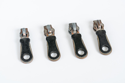 Metal bulldog clips isolated on white background with clipping mask.