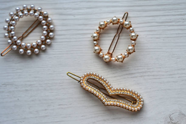 istock Women's hairpins with pearls on a white background 1484343682