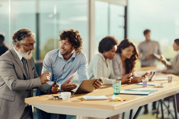 istock Group of entrepreneurs using wireless technology in the office. 1484346649