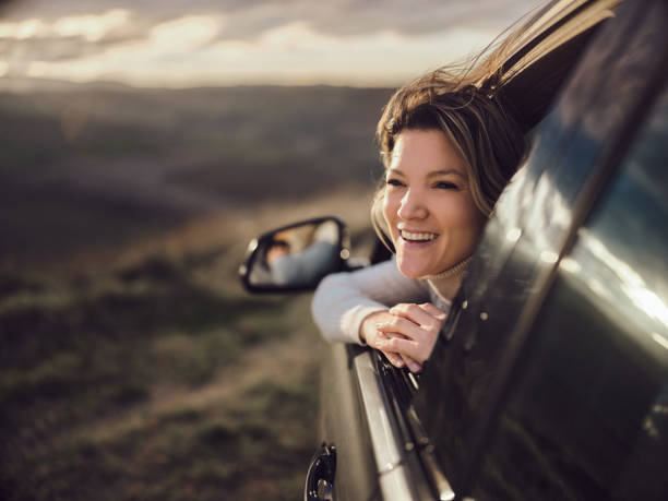istock Happy woman enjoying in a car. 1484351273