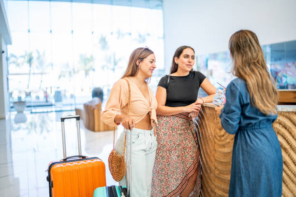 istock Receptionist talking customers at hotel lobby 1484358265
