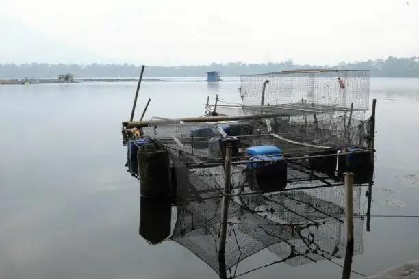 Floating fishpen or fish cage in Sampaloc Lake in San Pablo City, Laguna, Philippines.