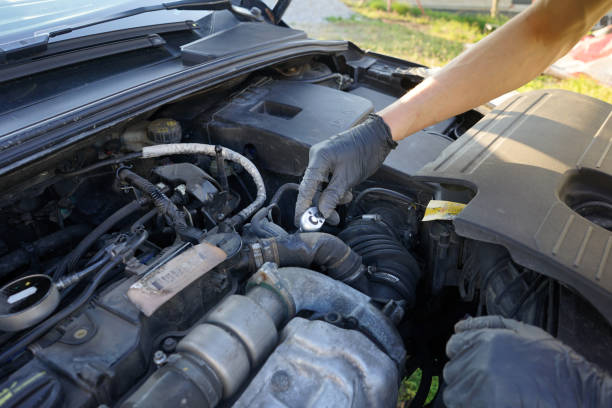 istock Mechanic checking the engine. Car service, mechanic repairing the engine. Worker inspecting car engine inside. 1484365191