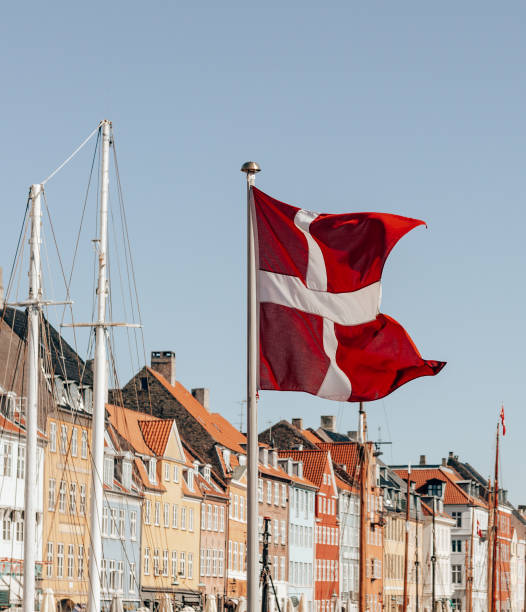 istock danish flag waving on the sky 1484368039